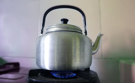 kettle boiling Vintage on the stove Old aluminum photo