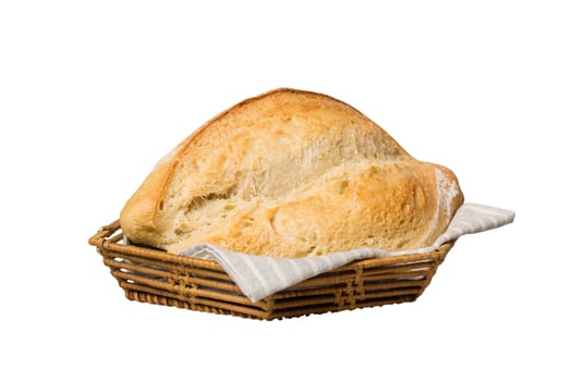 Freshly baked bread on basket isolated on white background. Perspective view bread photo