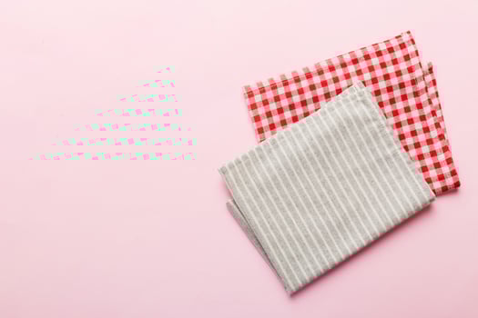 top view gray kitchen napkin isolated on table background. Folded cloth for mockup copy space photo