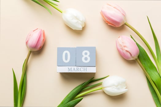 8 March, International Women's Day. greeting card design with tulips and calendar top view photo