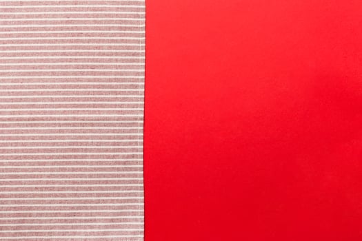 top view red empty kitchen napkin isolated on table background. photo