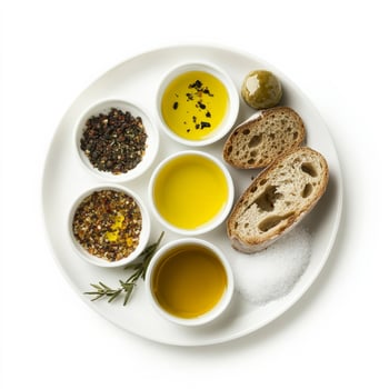 A tasting plate of oils or salts, each presented in a small dish with bread, allowing the diner to explore subtle differences in flavor and texture, highlighting the importance of the building blocks photo