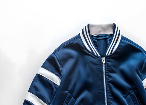 Deep blue bomber jacket with white stripes. photo