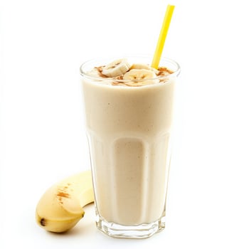 A glass of milk with a banana and a straw photo