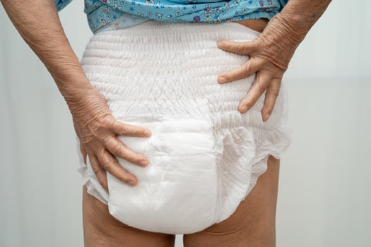 Asian senior woman patient wearing incontinence diaper. photo