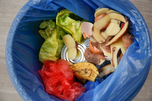 Various household waste in trash can. photo