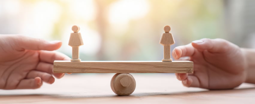 The balance between two figures representing equality and teamwork. photo