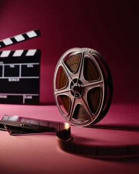 Film Production Vintage Scene Featuring Film Reel and Clapper Board photo