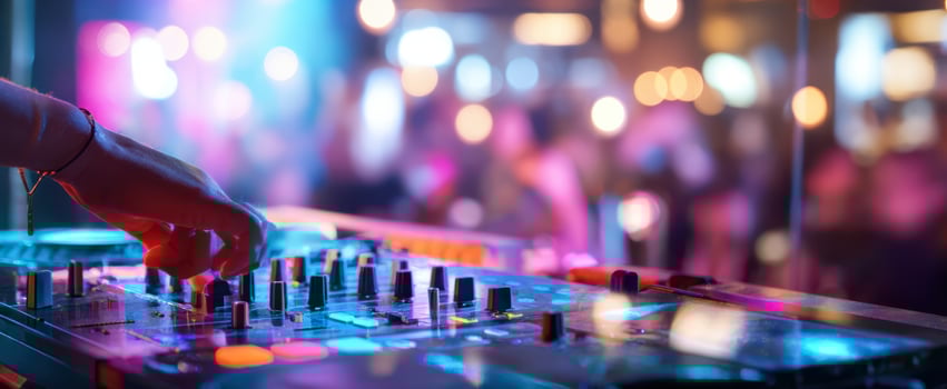 The DJ mixing vibrant beats in an energetic nightlife atmosphere. photo