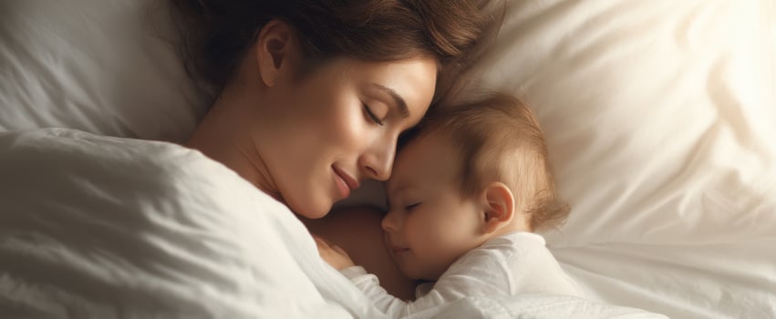 The tender moment between a mother and her baby while sleeping peacefully. photo