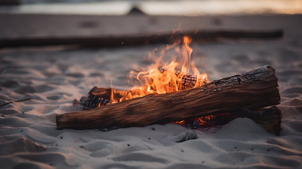 Close-up of a burning log on a beach photo