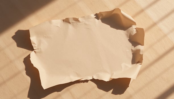 A piece of paper on a wooden table photo