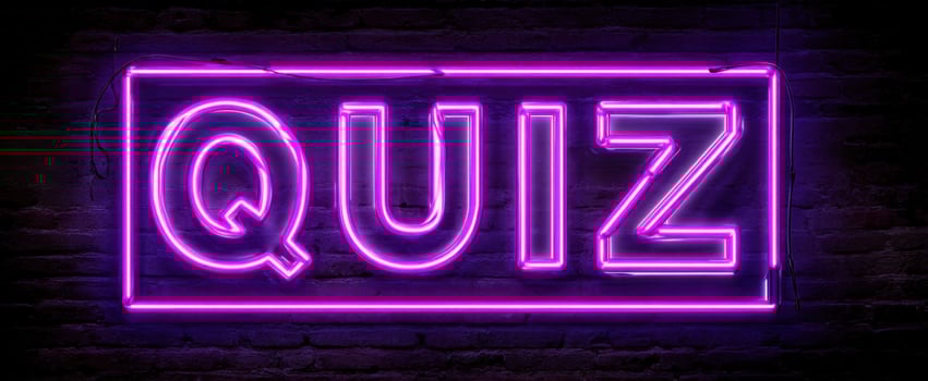 The Neon Quiz Sign Illuminating a Playful Atmosphere for Fun Nights photo