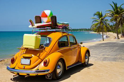 Beach Background Classic Orange VW Beetle Packed for Beach Vacation Surfboard Ball Cooler photo