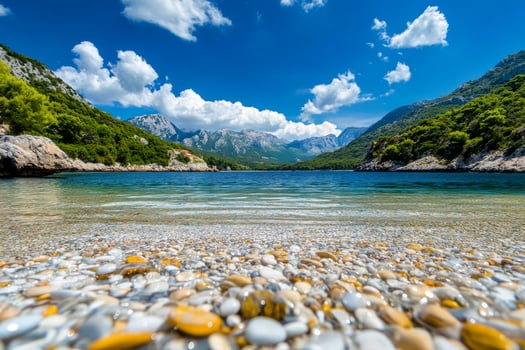 Crystal Clear Water Reveals Colorful Stones Beneath Sunny Skies in Scenic Coastal Landscape. photo