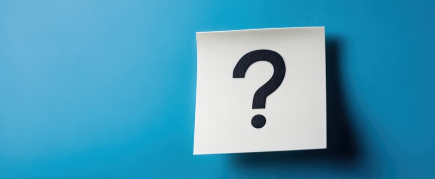 The Blank Note with a Question Mark on a Blue Background photo