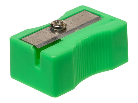 Green plastic pencil sharpener with metal blade on isolated background photo