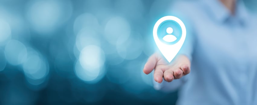 The hand presenting a digital location pin symbolizing connectivity and user engagement. photo