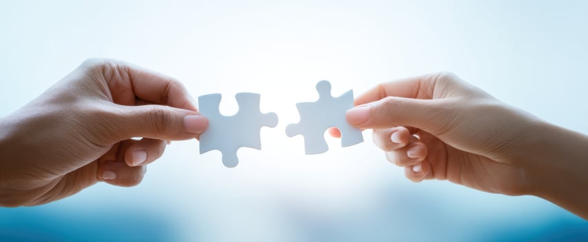 The Hands Connecting Puzzle Pieces Symbolizing Collaboration and Unity photo