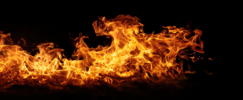 The Vibrant Flames Dancing Against a Dark Background photo