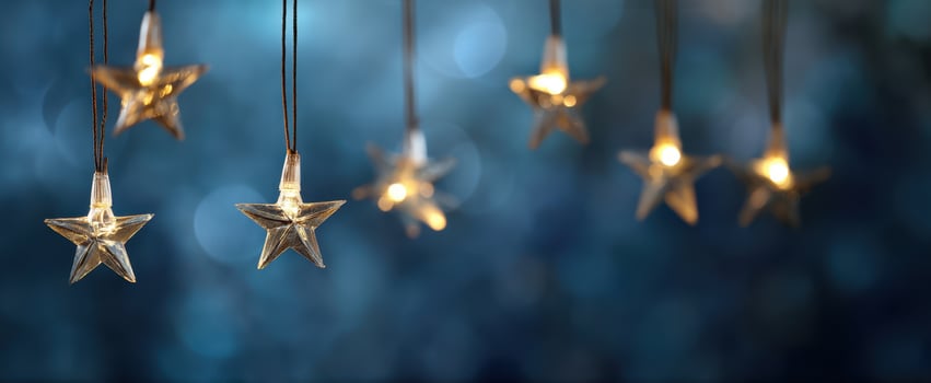 The glowing star lights illuminating a dreamy blue background photo