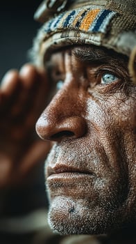 Elderly man saluting with a focused expression in a dark setting, highlighting deep life experiences and wisdom photo