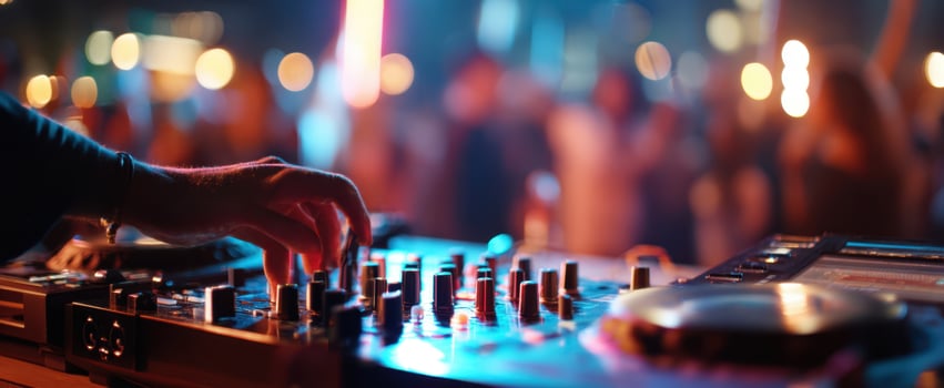 The DJ controls a vibrant atmosphere at an electrifying nightlife event. photo