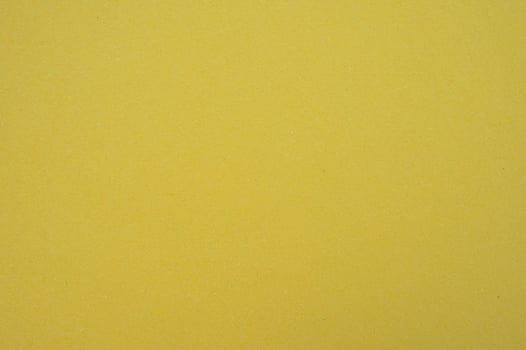 Full frame shot of yellow paper sheet texture and background. photo