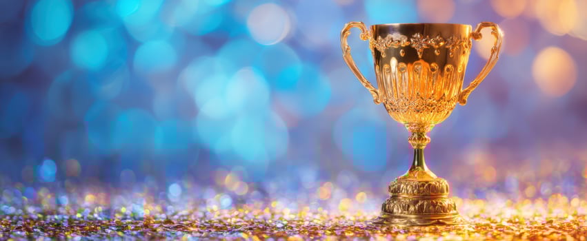 The shimmering golden trophy celebrating achievement and success against a vibrant backdrop. photo