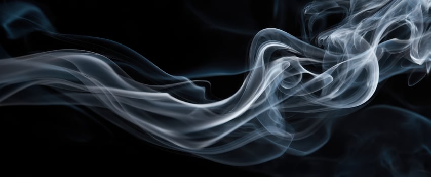 The ethereal beauty of smoke swirling gracefully against a dark background. photo
