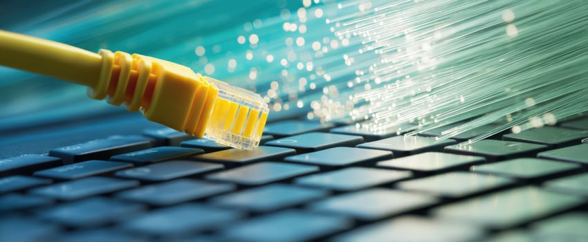 The Ethernet cable connecting to a keyboard, symbolizing digital connectivity and speed. photo