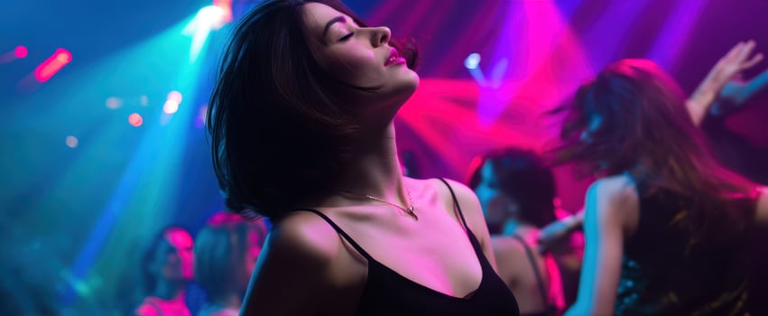 The Joyful Dance of a Young Woman in a Colorful Nightclub Atmosphere photo
