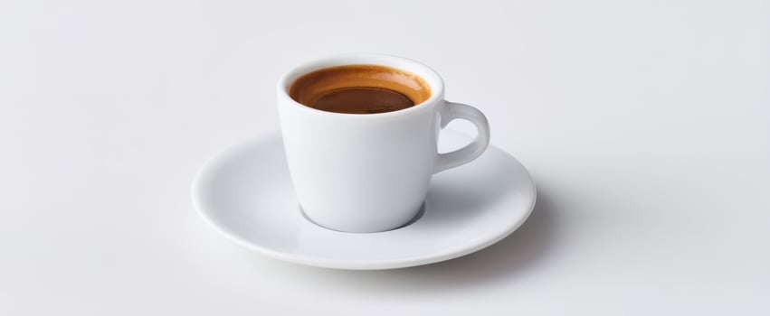 The elegant espresso cup on a pristine white background. photo