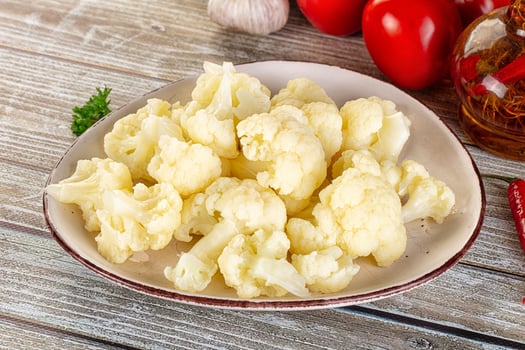 A white plate with a bunch of cauliflower on it photo