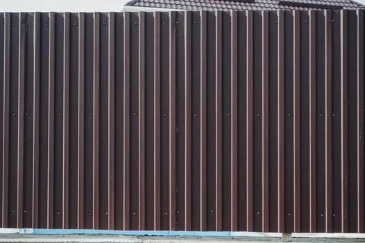 horizontal brown metal fence panel. photo