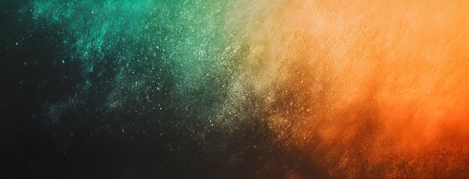 A burst of vibrant teal and orange powder creates an elegant abstract design photo