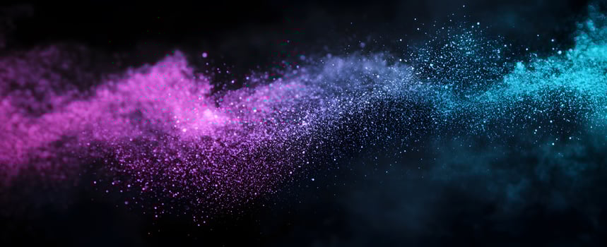 A magical cosmic dust cloud scatters vibrant purple and turquoise sparkles against a black backdrop photo