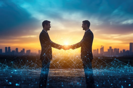 Business partnership at sunset. Two businessmen shaking hands, connected by digital network photo