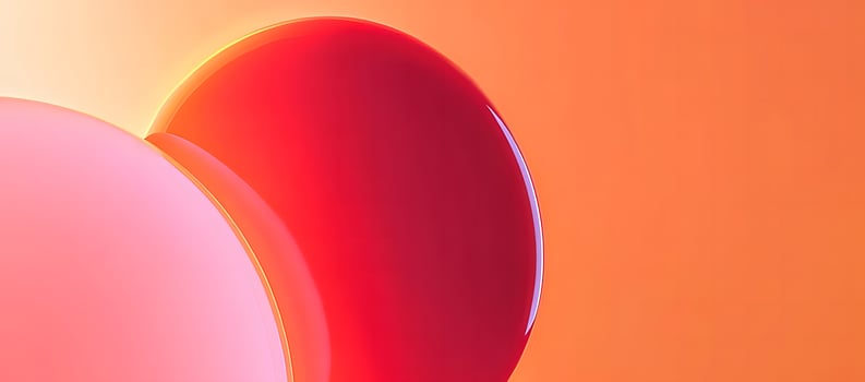 Abstract forms in pink and red dominate the frame with an orange gradient background photo