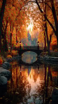 Autumn colors reflected in tranquil water under a charming bridge at dawn in a serene park photo