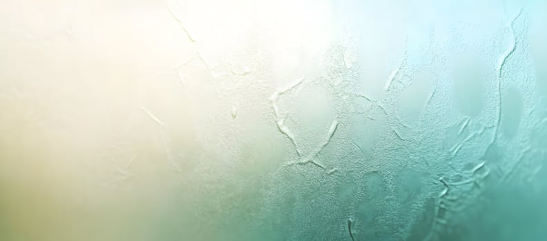 Abstract textured background showcases light patterns on a misty, light blue and green surface photo