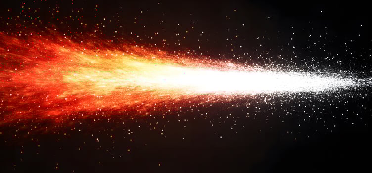 An abstract radiant trail of orange fades to white against a dark cosmic background photo