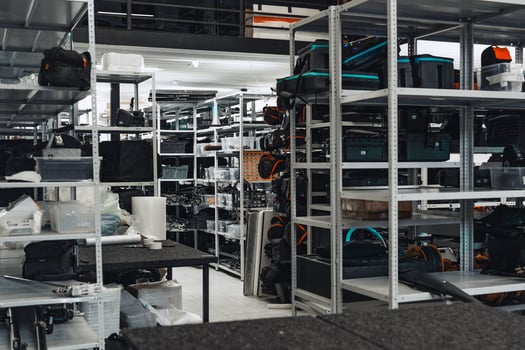 Storage area filled with camera equipment and accessories in a well-organized warehouse photo