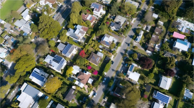 Residential neighborhood with solar panels in a suburban area during daylight photo
