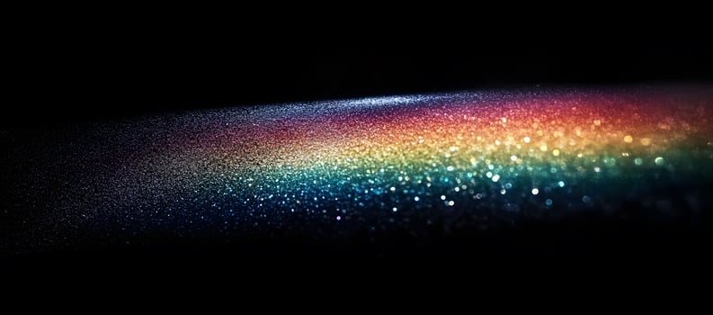 Dazzling light streak shimmers with a beautiful rainbow spectrum against the stark black backdrop photo