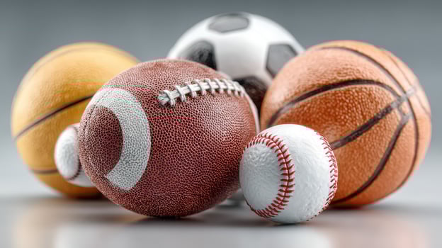 Variety of sports balls displayed on a neutral background showcasing popular games played around the world photo