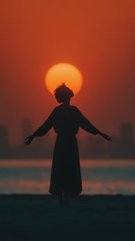Woman embraces sunset on beach with city skyline in background during golden hour photo
