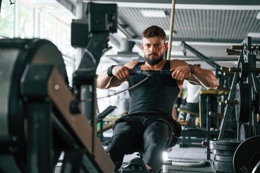 Exercise, for, stamina. Strong muscular man is working out in the gym photo
