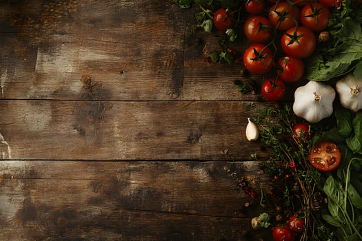 Fresh tomatoes, garlic and aromatic herbs are arranged on dark wooden surface for culinary use photo