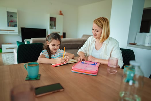 Mother and daughter enjoy creative time together at home photo